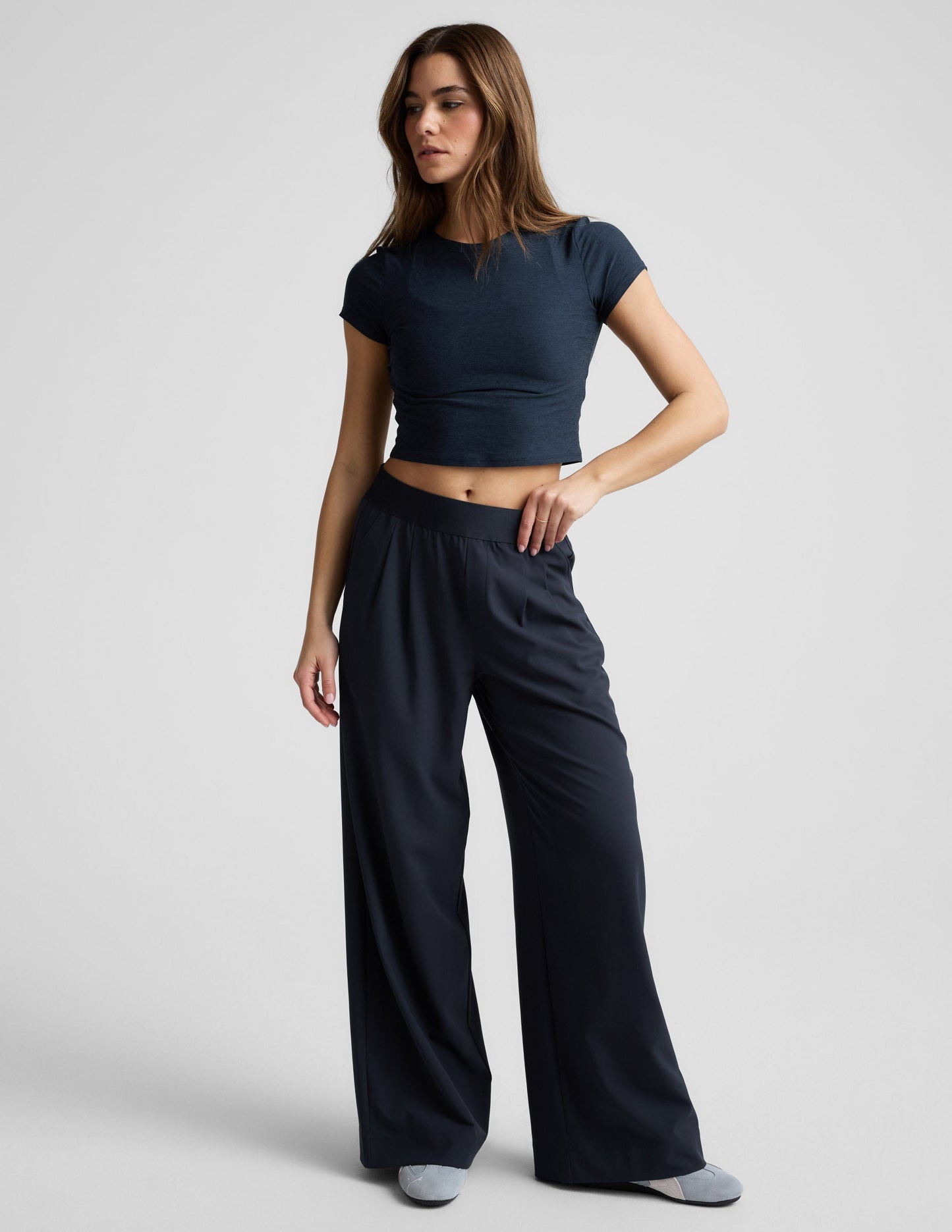 Model wears navy Elasticated Trouser Pant 29" featuring a wide-leg cut, pleated front, and mid-rise elastic waistband.