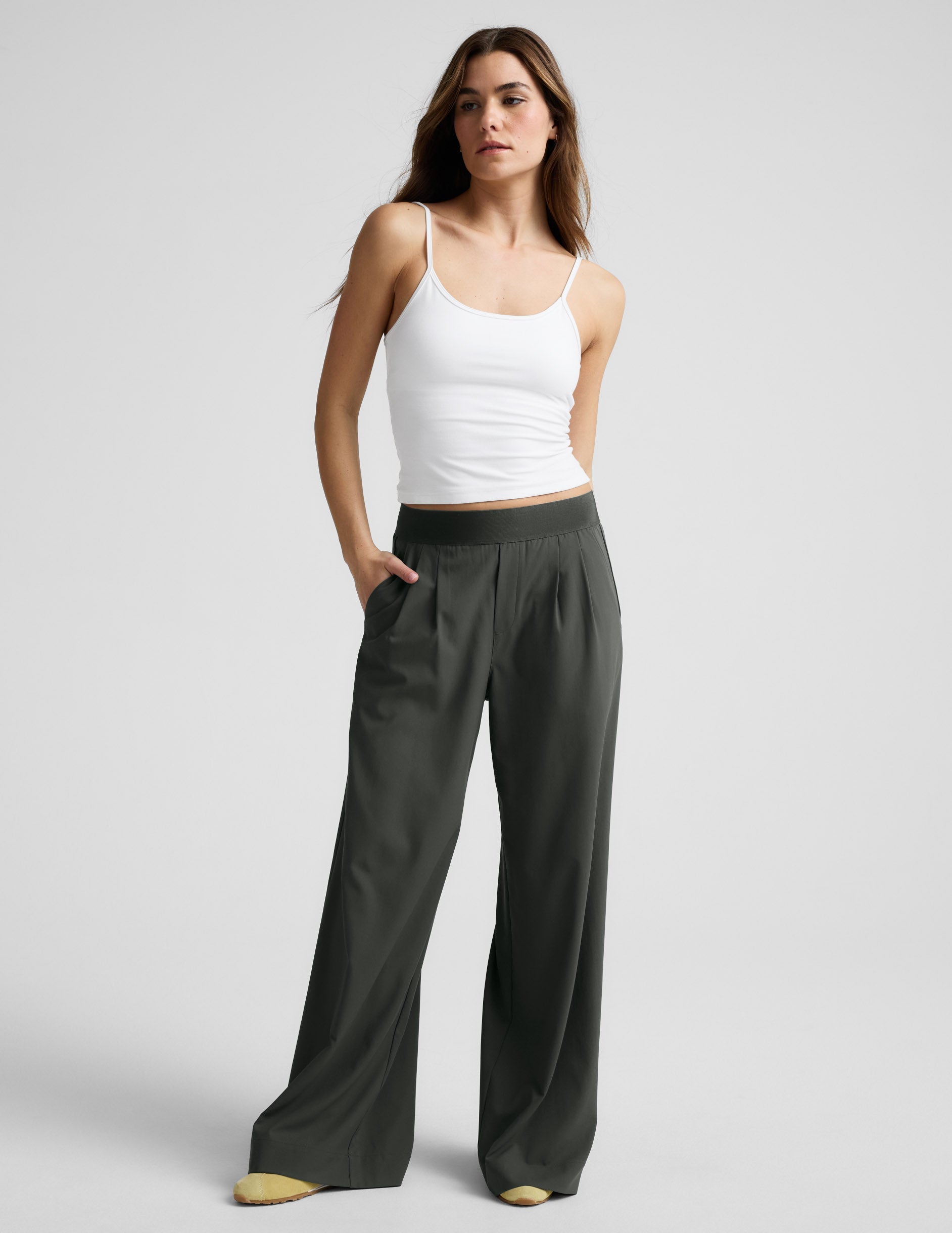 Woman wearing dark green Elasticated Trouser Pant 31" with a wide leg silhouette, pleats, and a comfortable elastic waist.
