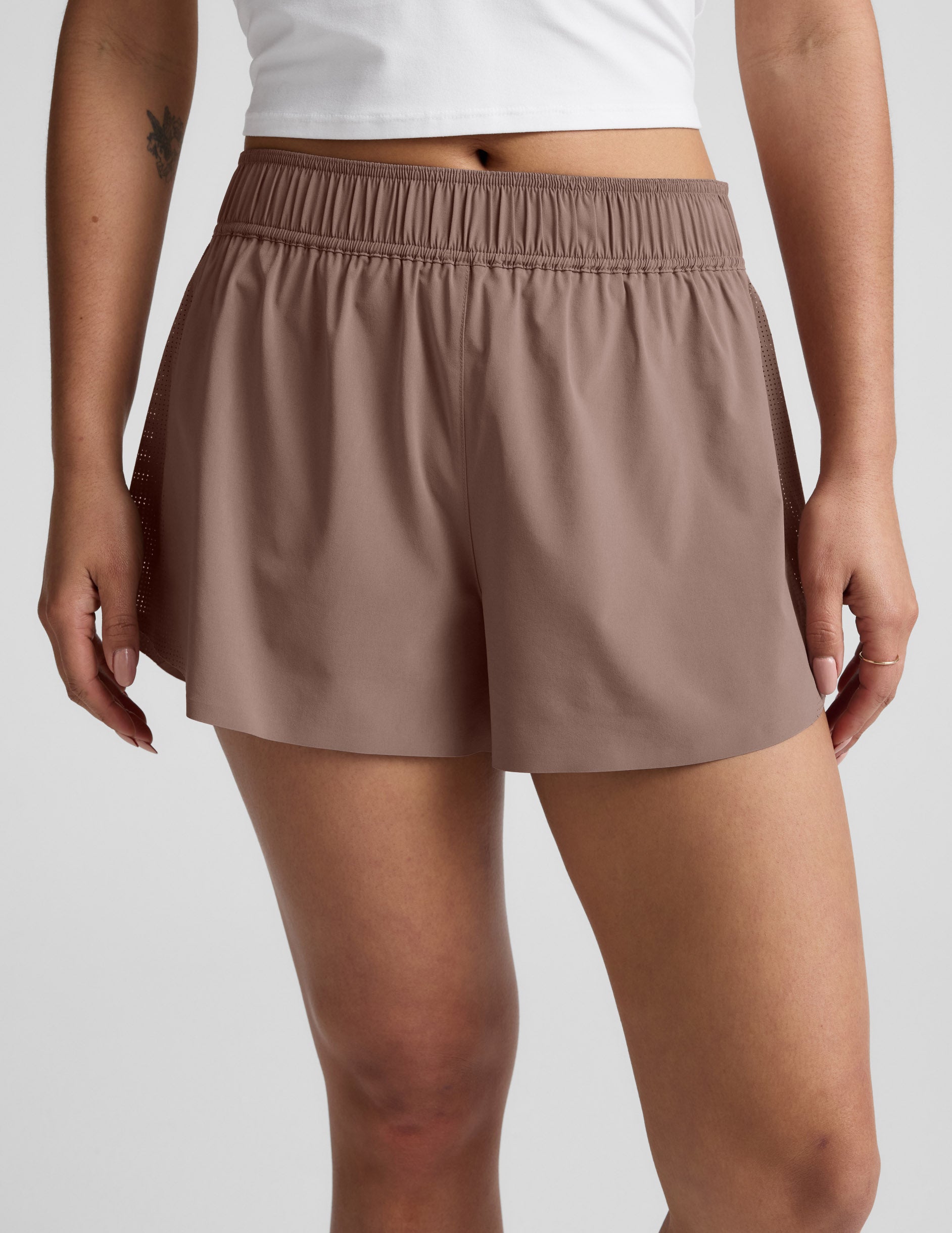 Brown Solemate 2.5" Short with a gathered elastic waistband and perforated side panels for a relaxed, athletic fit.