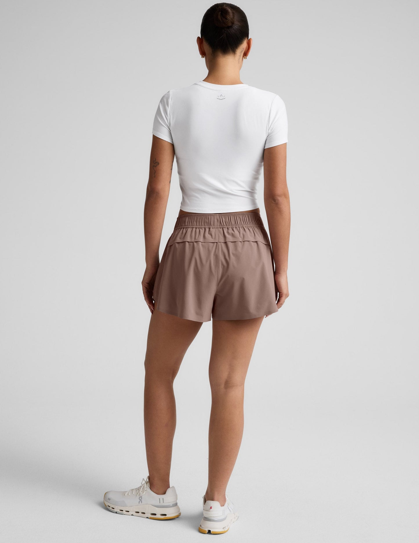 Rear view of brown Solemate 2.5" Short featuring a gathered elastic waistband and vented back panel for breathability.