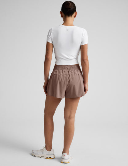 Rear view of brown Solemate 2.5" Short featuring a gathered elastic waistband and vented back panel for breathability.