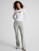 Woman in gray marled Spacedye Practice High Waisted Bootcut Pant with a wide waistband and full-length flared legs.