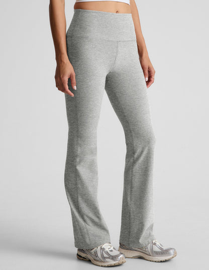 Light gray marled Spacedye Practice High Waisted Bootcut Pant featuring a wide waistband and flared hem, shown on a model.