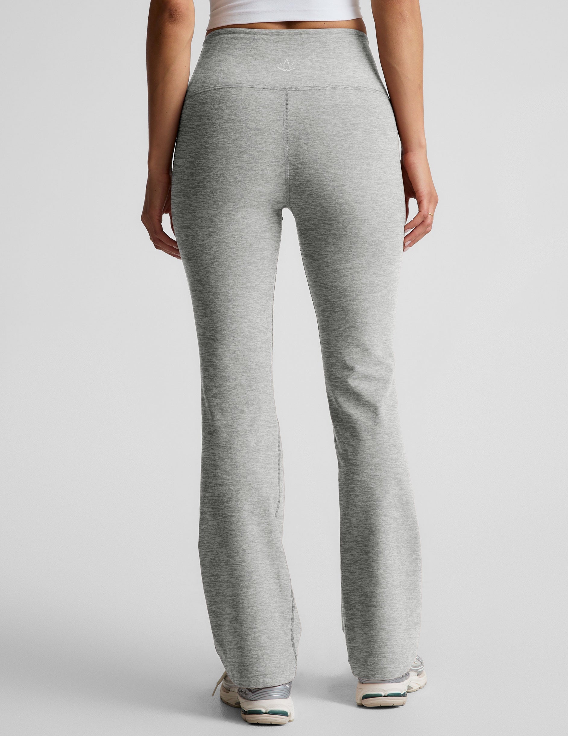 Back view of gray marled Spacedye Practice High Waisted Bootcut Pant showing the high waistband and flared leg opening.