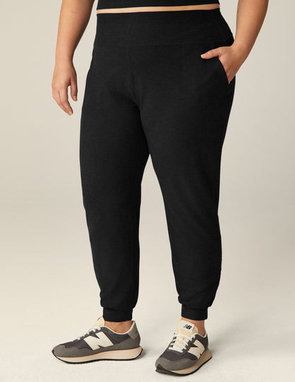 Black marled Spacedye Midi Jogger featuring a wide waistband, side pockets, and tapered banded cuffs at the ankles.