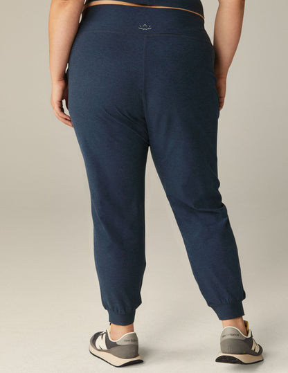 Rear view of a person wearing Spacedye Midi Joggers in nocturnal navy with a tapered fit, wide waistband, and banded cuffs.