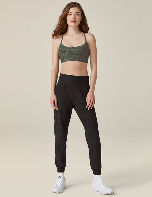 Woman wearing the Spacedye Midi Jogger in marled black featuring a wide waistband and tapered legs with banded cuffs.
