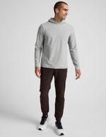 Man wearing slim-fit, dark Spacedye Freefit Men's Zipper Pockets Jogger with banded cuffs and elastic waistband.
