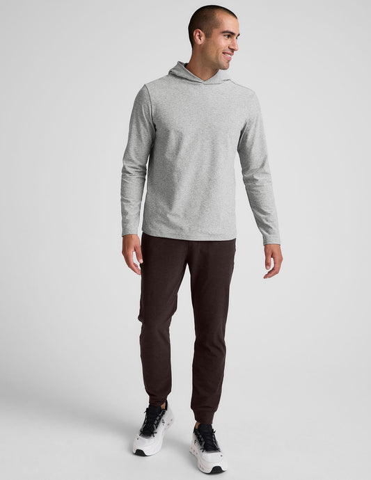 Man wearing slim-fit, dark Spacedye Freefit Men's Zipper Pockets Jogger with banded cuffs and elastic waistband.