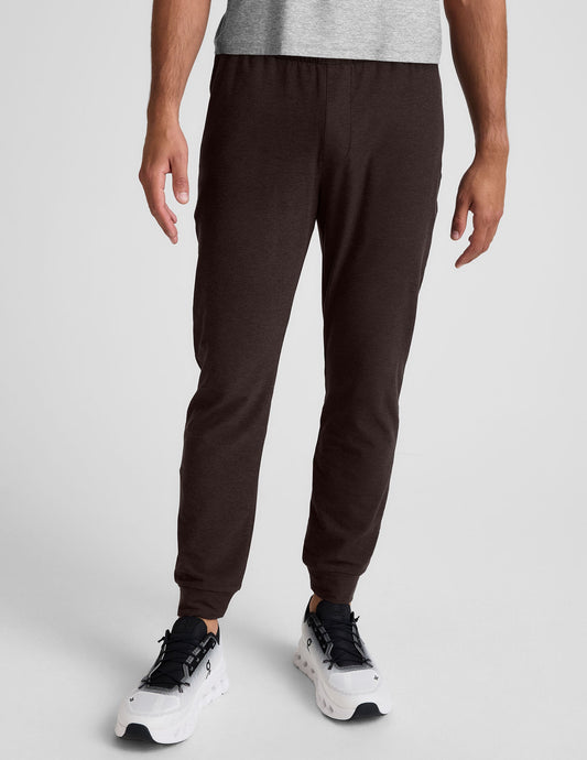 Slim-fit Spacedye Freefit Men's Zipper Pockets Jogger in gray marled fabric with an elastic waistband and banded cuffs.