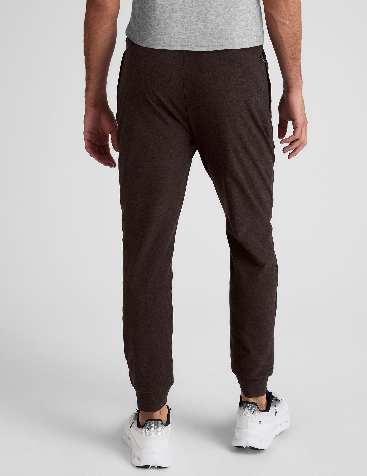 Rear view of dark marled Spacedye Freefit Men's Zipper Pockets Jogger with slim-fit legs and tapered banded cuffs.