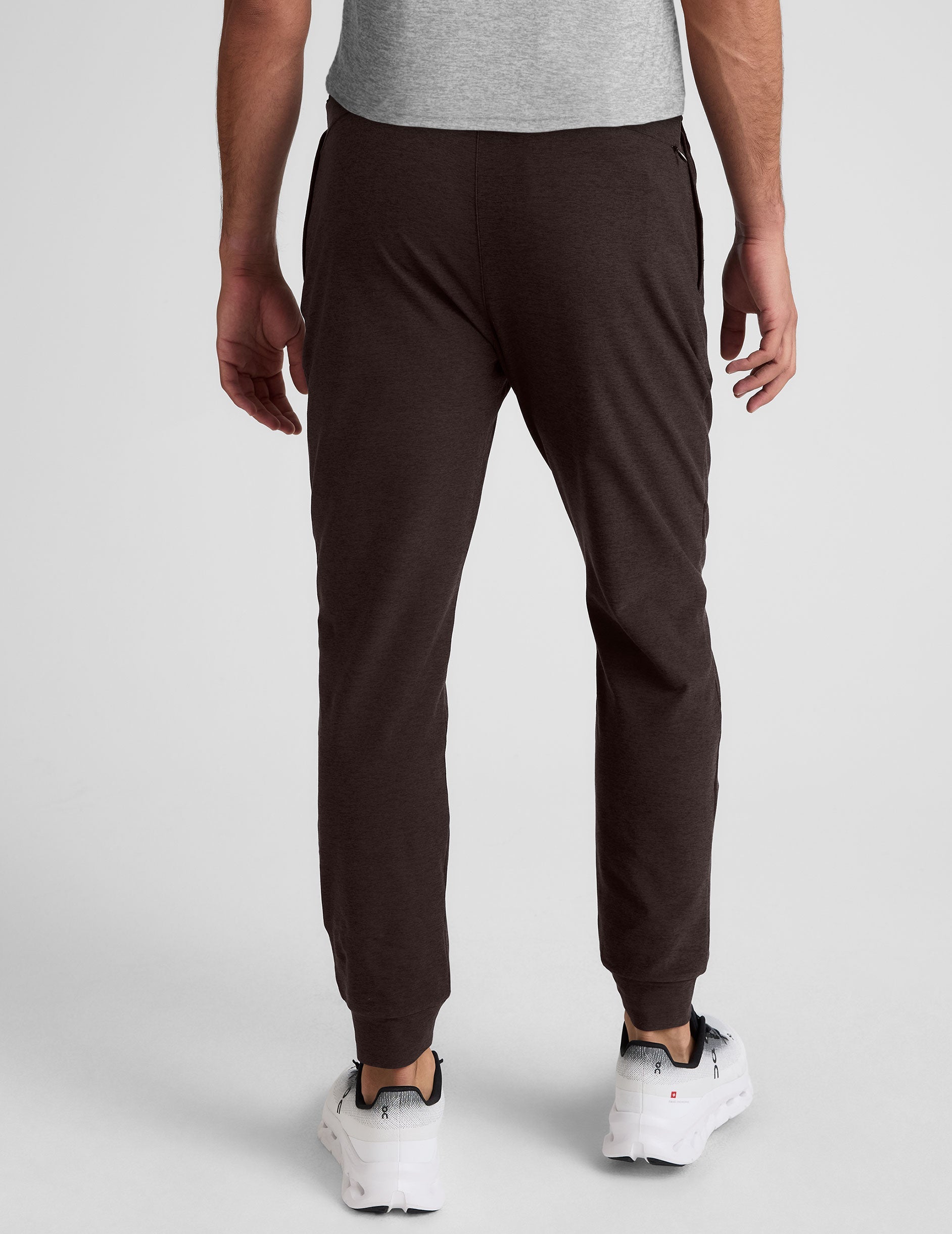 Rear view of dark marled Spacedye Freefit Men's Zipper Pockets Jogger with slim-fit legs and tapered banded cuffs.