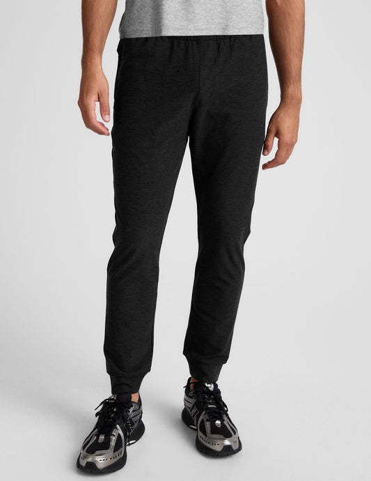 Front view of black Spacedye Freefit Men's Zipper Pockets Jogger, slim fit with elastic waist and banded cuffs at ankles.