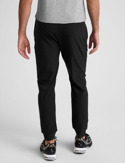 Back view of black Spacedye Freefit Men's Zipper Pockets Jogger with a slim, tapered fit and banded ankle cuffs.