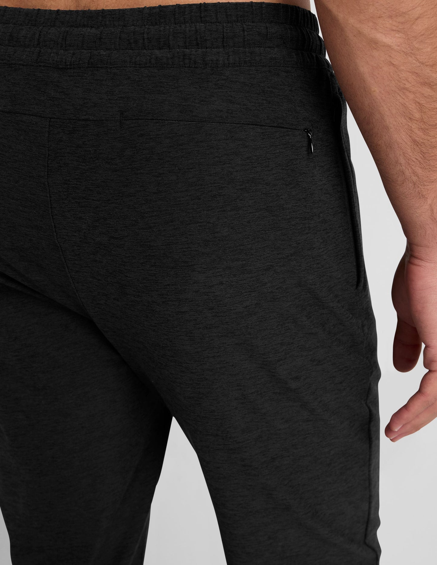 Black Spacedye Freefit Men's Zipper Pockets Jogger close-up showing textured fabric and a hidden back zipper pocket.