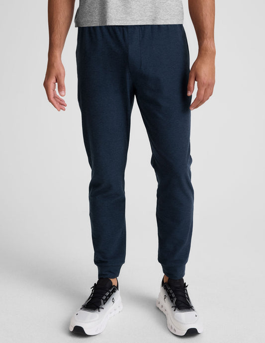 Spacedye Freefit Men's Zipper Pockets Jogger in navy marled fabric with a slim fit and banded cuffs on a model.