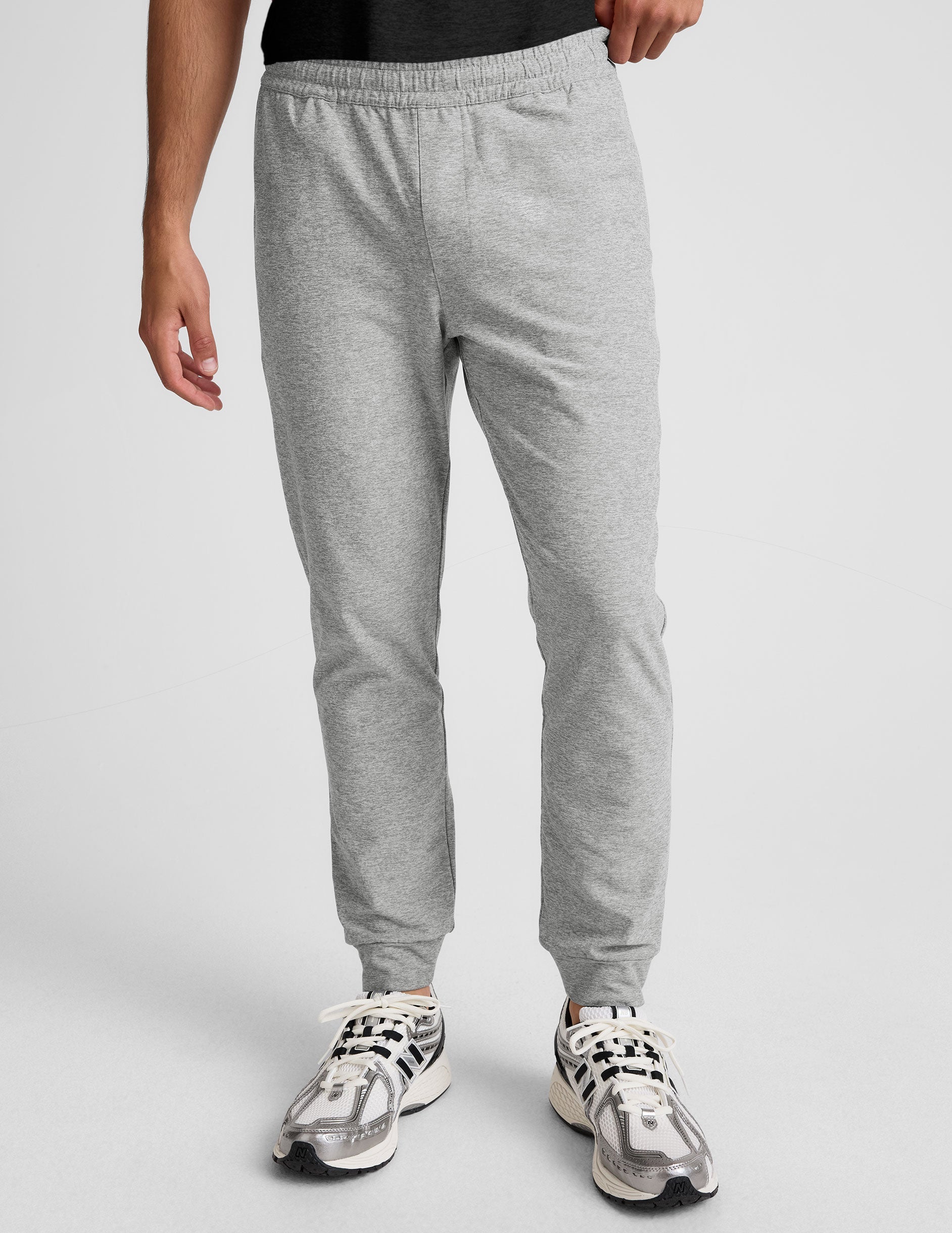 Slim-fit light gray marled Spacedye Freefit Men's Zipper Pockets Jogger with elastic waistband and banded cuffs.