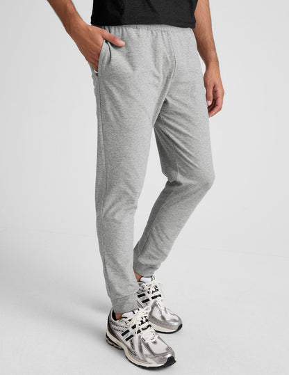Light grey marled Spacedye Freefit Men's Zipper Pockets Jogger with a slim fit, elastic waist, and zippered side pockets.
