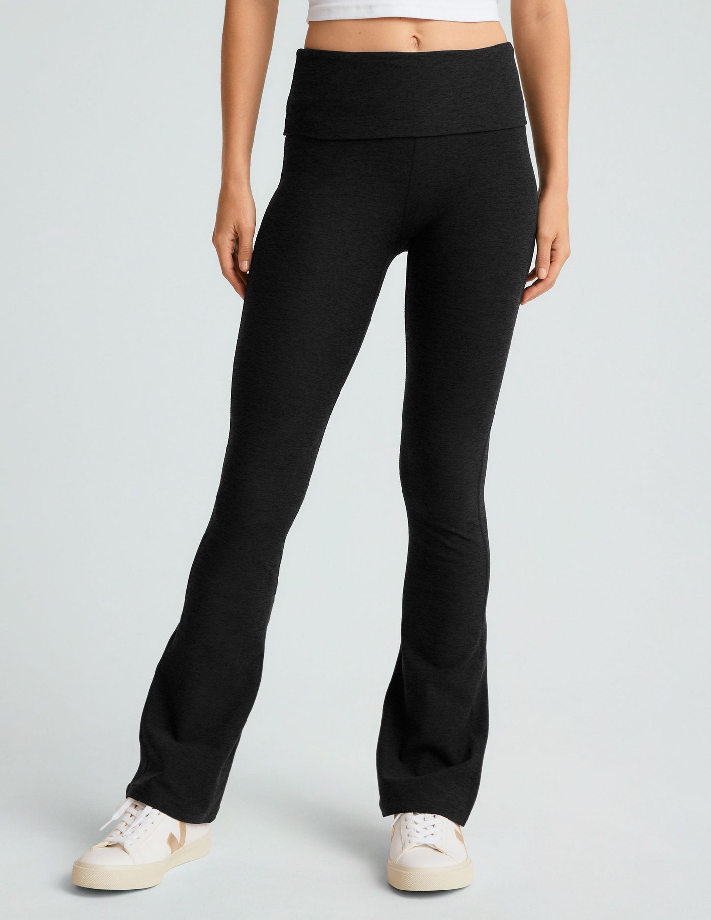 Black Spacedye Foldover Bootcut Pant with a wide high waistband and flared legs, styled on a model with white sneakers.