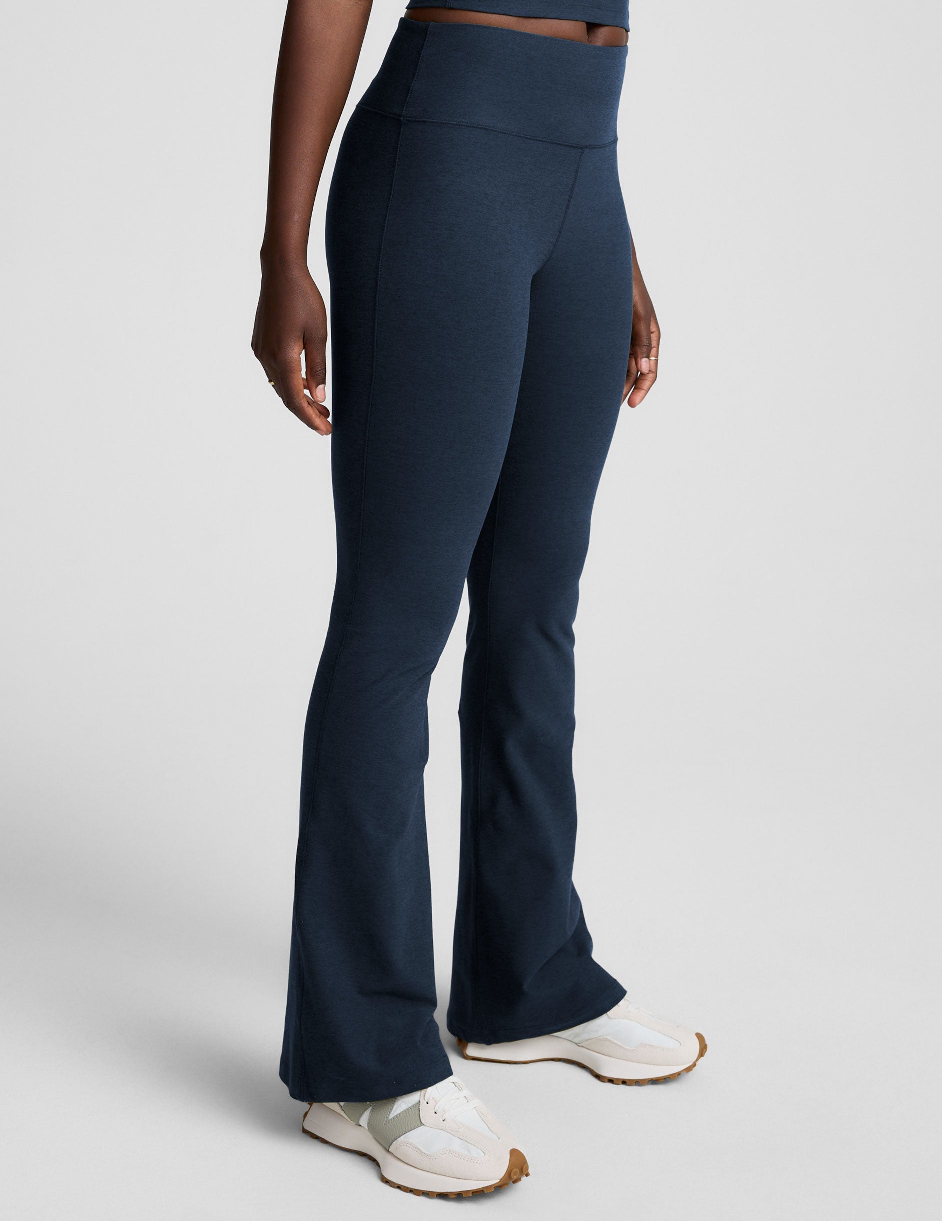 Navy Spacedye Mid-Rise Bootcut Pant on a model, featuring a wide mid-rise waistband and flared leg with a snug fit.