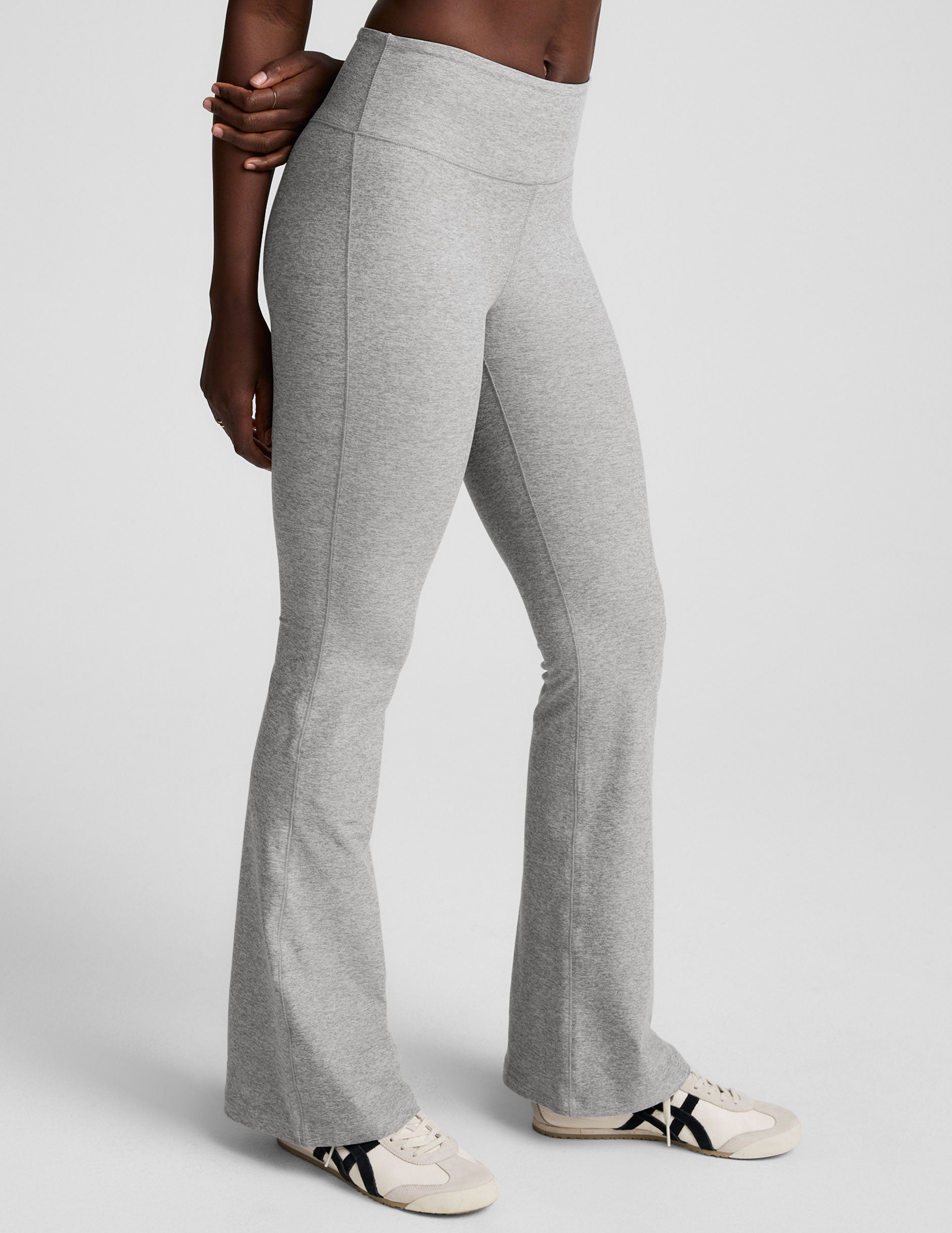 Side view of the gray marled Spacedye Mid-Rise Bootcut Pant featuring a wide waistband and a flared hem.