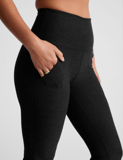 Black Spacedye High Waisted Practice Pocket Bootcut Pant featuring a high waistband and hand in the slanted hip pocket.