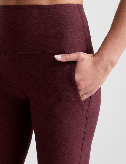 Close-up of woman with hand in slanted hip pocket of the Maroon Spacedye™ High Waisted Practice Pocket Bootcut Pant.