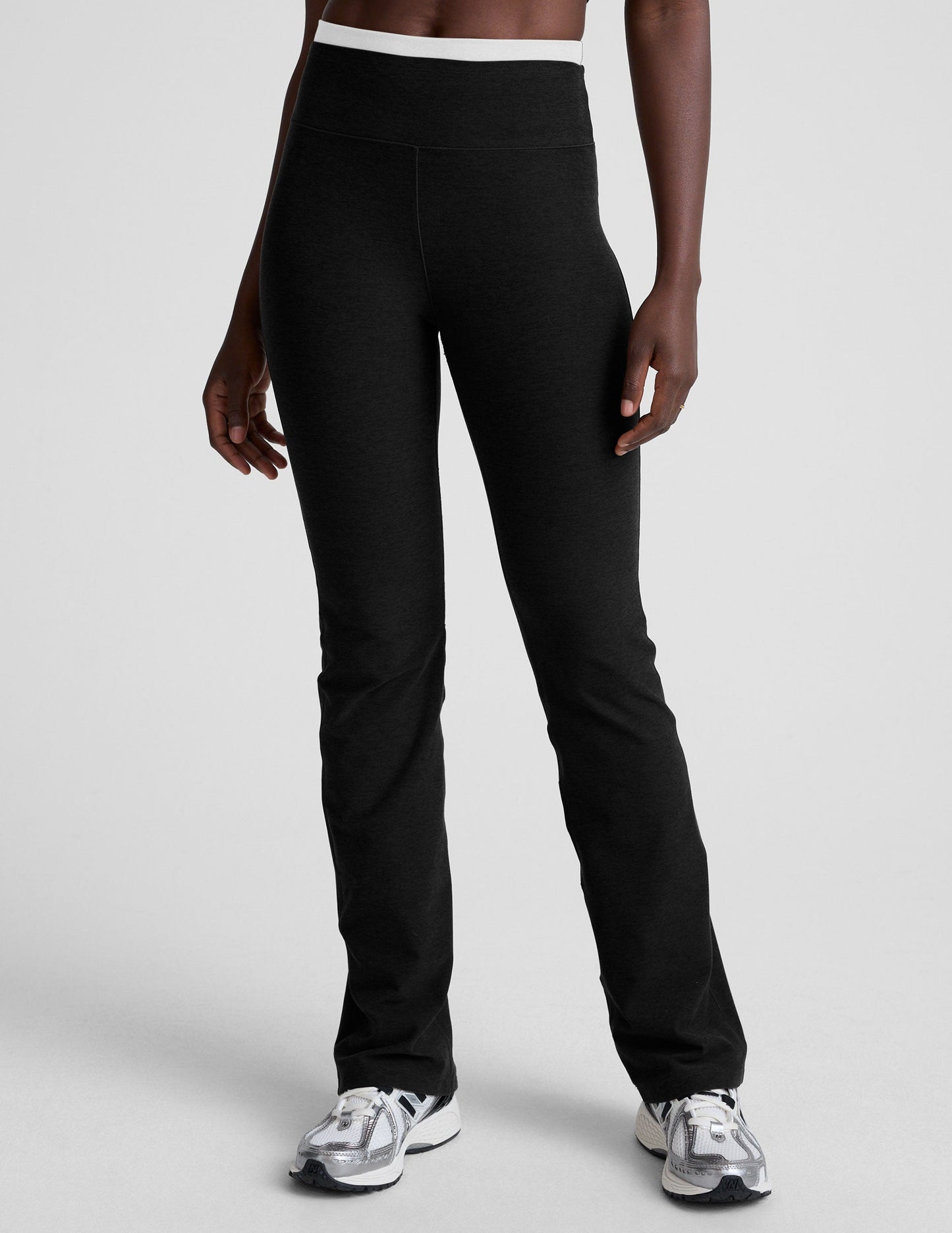 Black Spacedye Layered Bootcut Pant featuring a white contrast high waistband and a flared leg on a model.