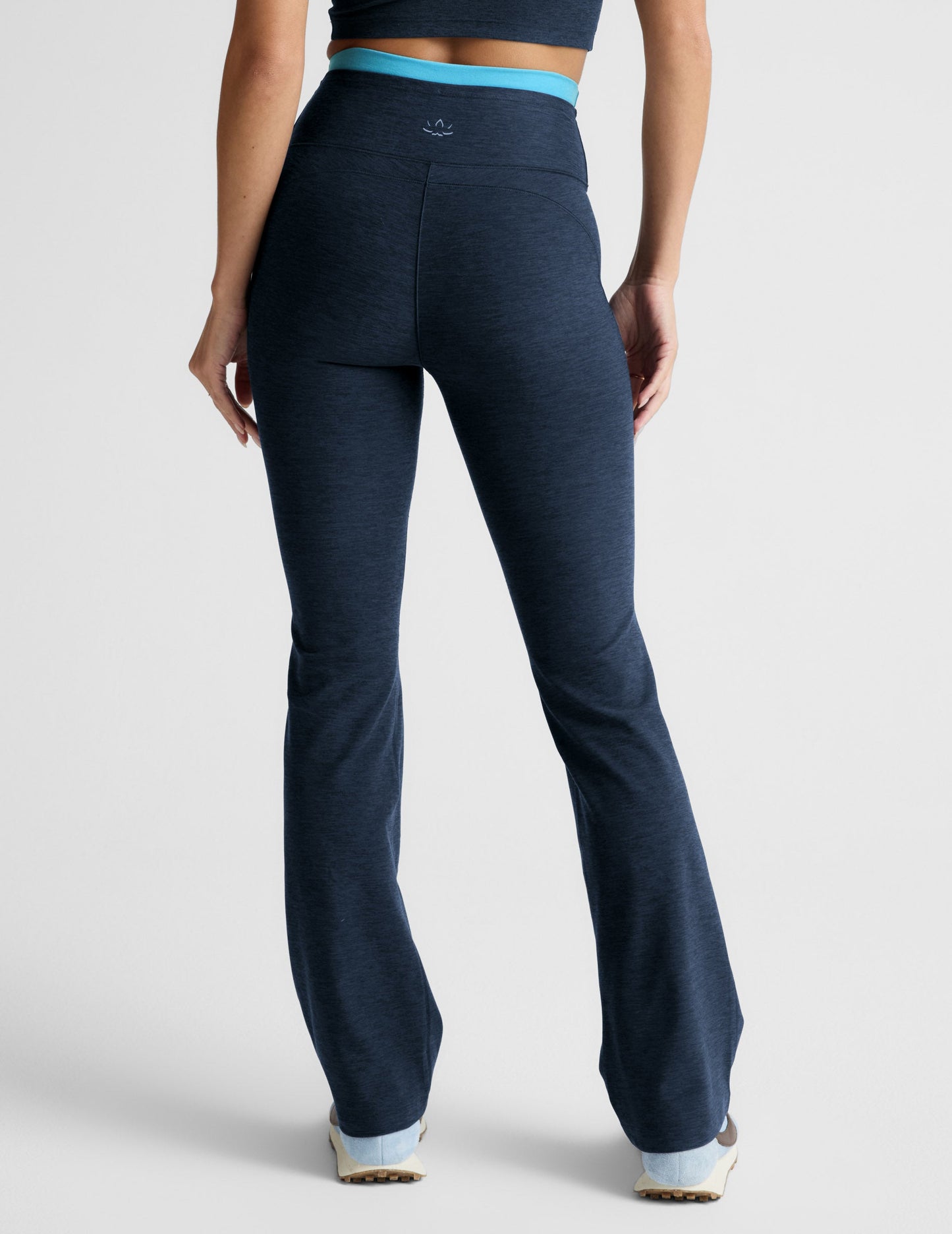 Rear view of navy Spacedye Layered Bootcut Pant featuring a high-waist double layer waistband in bright blue.