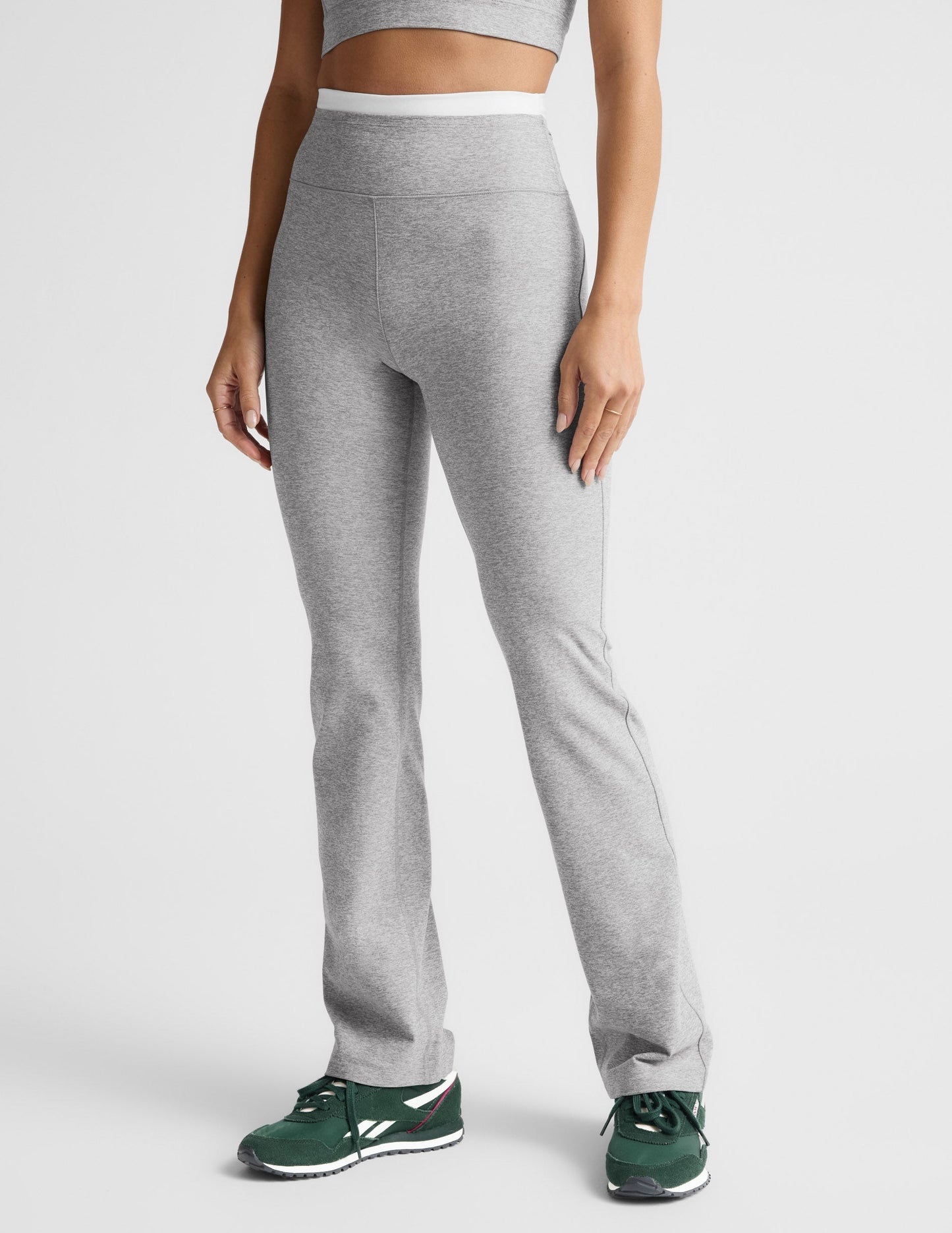 Gray marled Spacedye Layered Bootcut Pant with a high white contrast waistband and flared leg on a standing model.