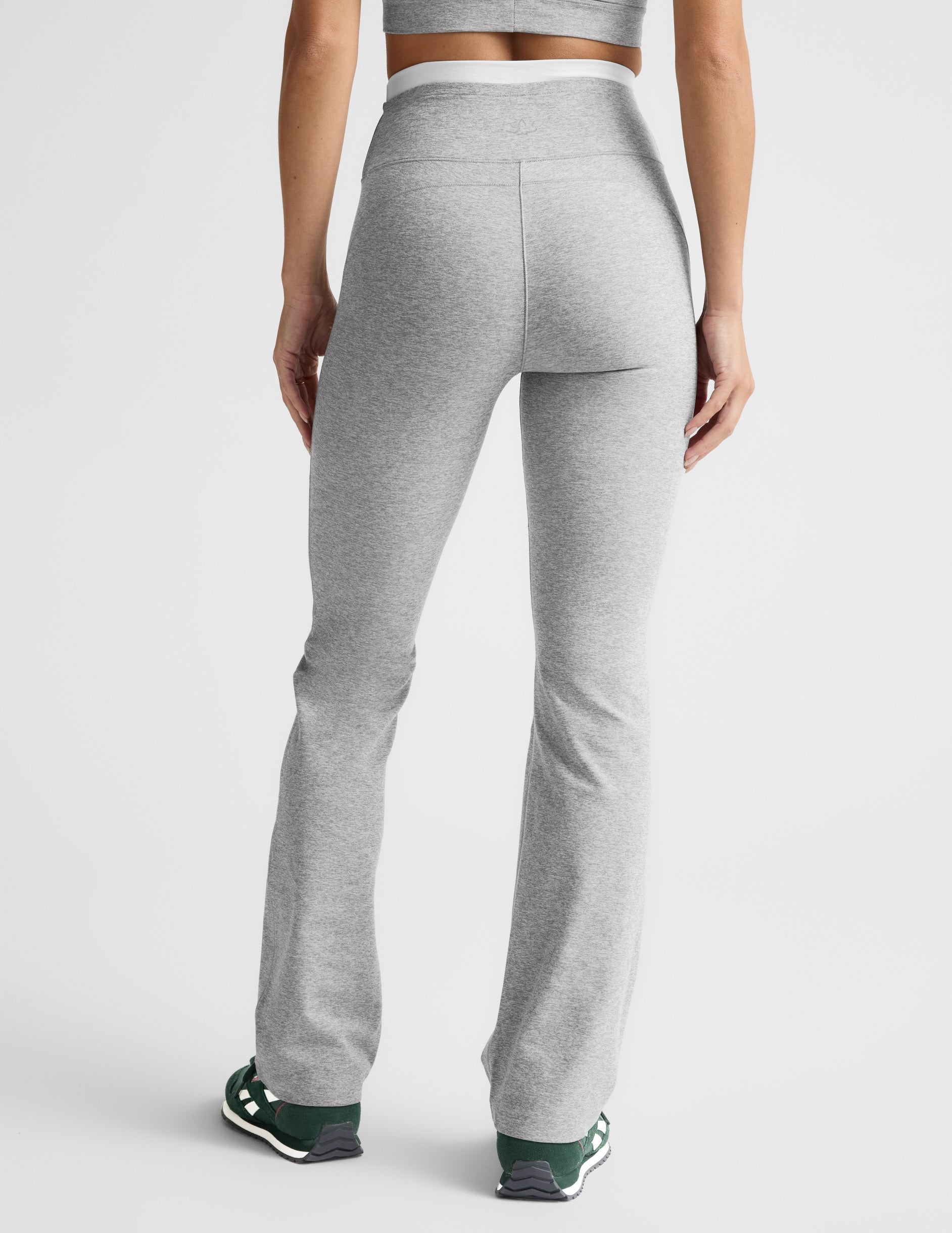 Rear view of the gray Spacedye Layered Bootcut Pant featuring a white contrast waistband and snug fit with a flared hem.