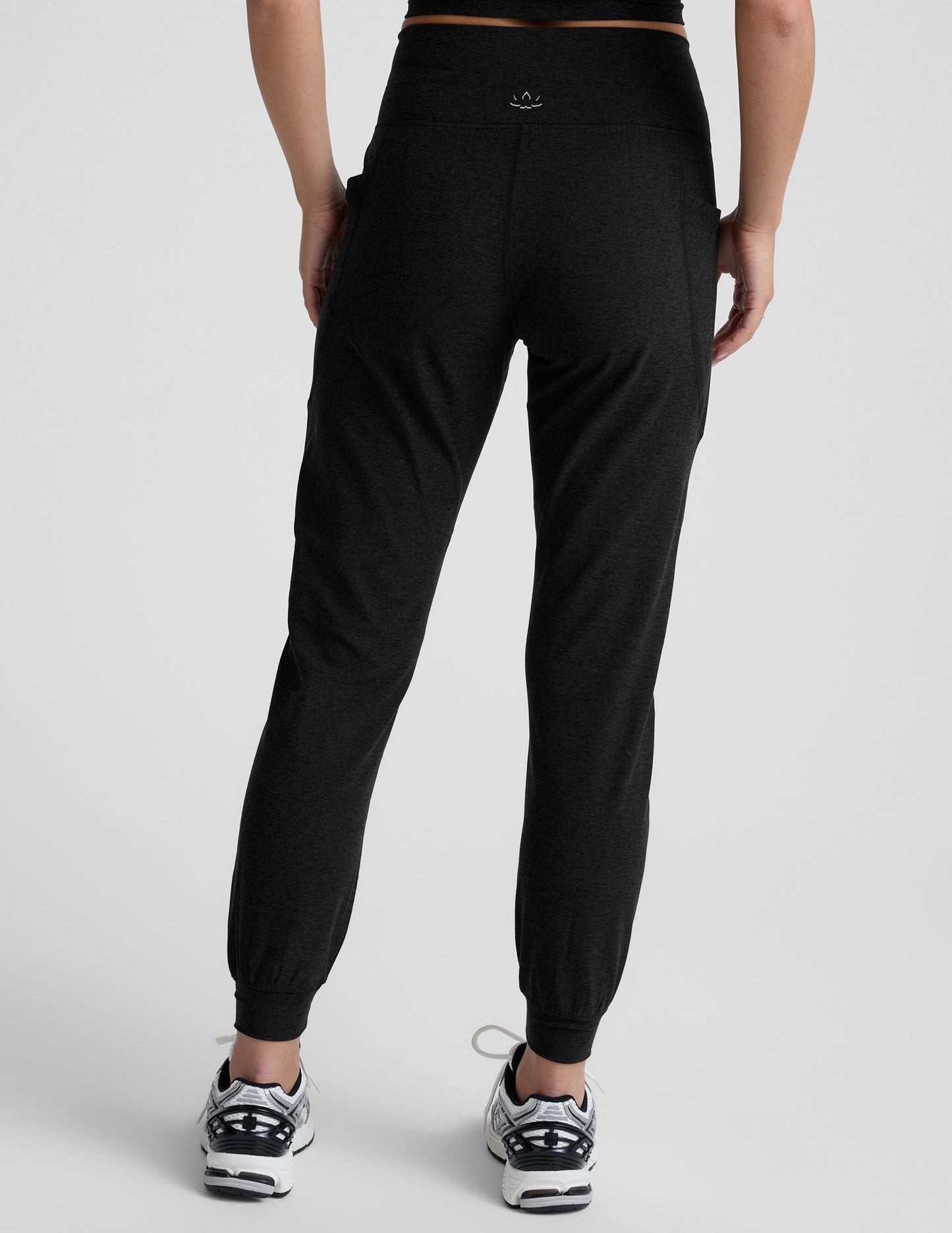 Rear view of black Spacedye Go Pocket Joggers showing high wide waistband, side pockets, and tapered ankles with cuffs.