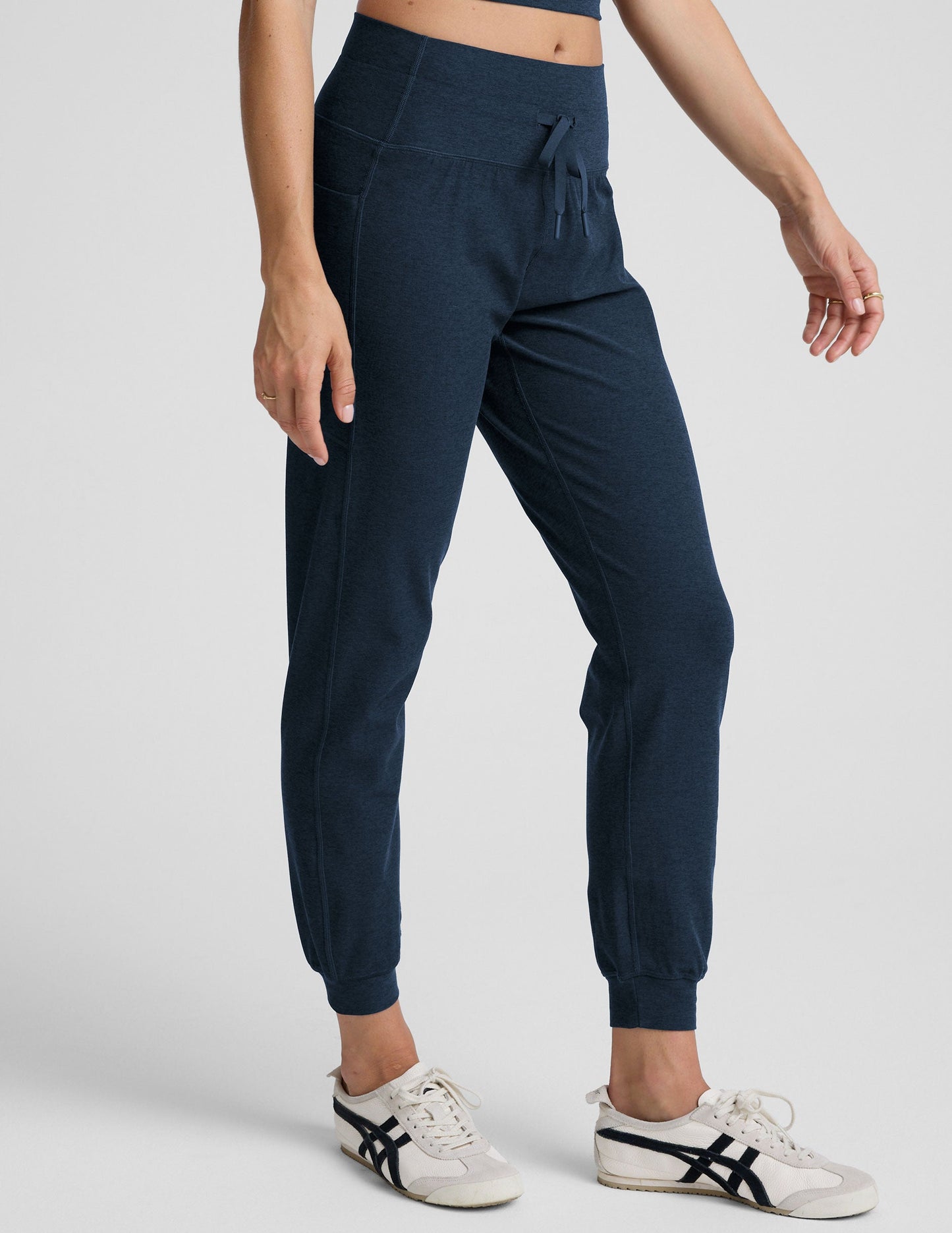 Navy Spacedye Go Pocket Jogger with high-rise drawstring waist, side pockets, and cuffed hems, shown on a model.