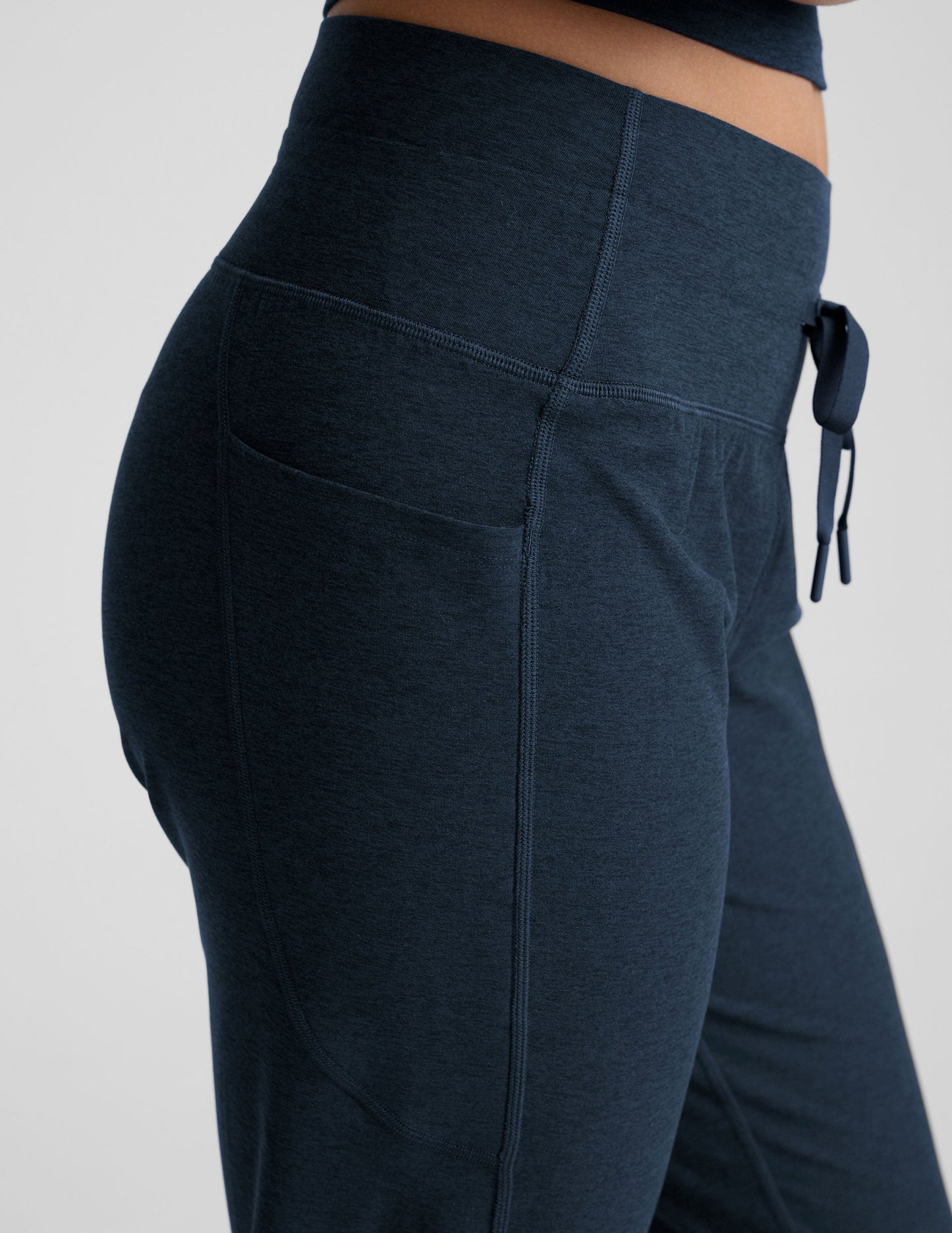 Navy Spacedye Go Pocket Jogger featuring a high waist, drawstring tie, and side pocket in a soft, textured fabric.