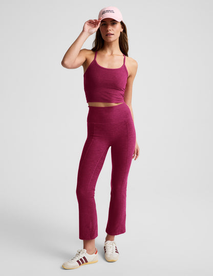 Model wearing maroon Spacedye Pintuck Kick Flare High Waisted Pant with vertical front seams and a flared leg.