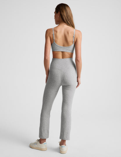 Back view of grey marled Spacedye Pintuck Kick Flare High Waisted Pant featuring a high rise waist and flared ankle hem.