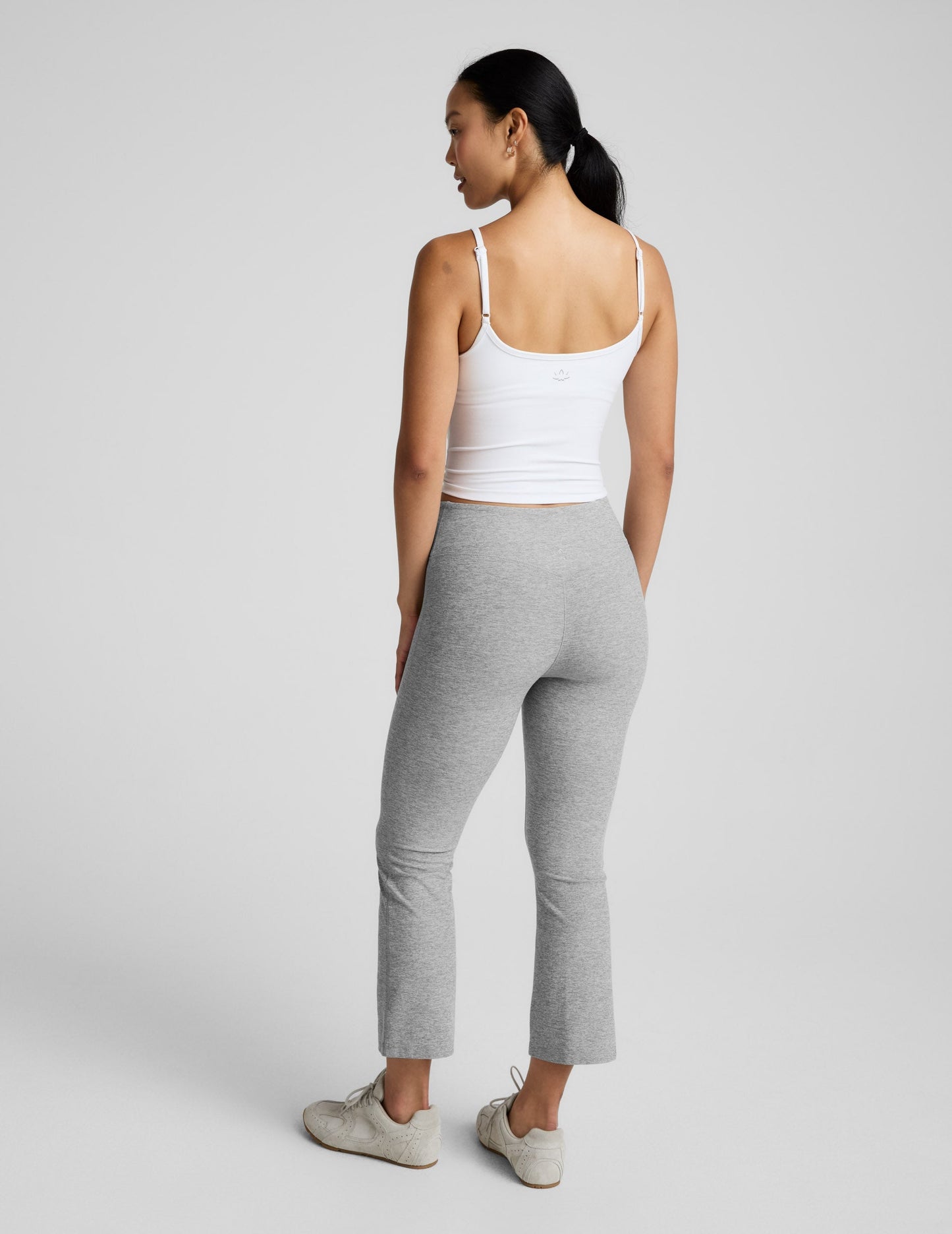 Back view of grey marled Spacedye Pintuck Kick Flare High Waisted Pant featuring a snug fit and cropped flared legs.