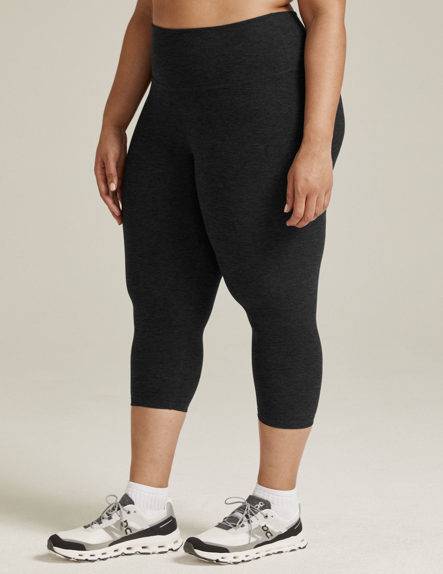 Spacedye Walk And Talk High Waisted Capri Legging in charcoal marled fabric, hitting at the low calf on a standing model.