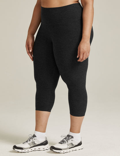 Spacedye Walk And Talk High Waisted Capri Legging in charcoal marled fabric, hitting at the low calf on a standing model.