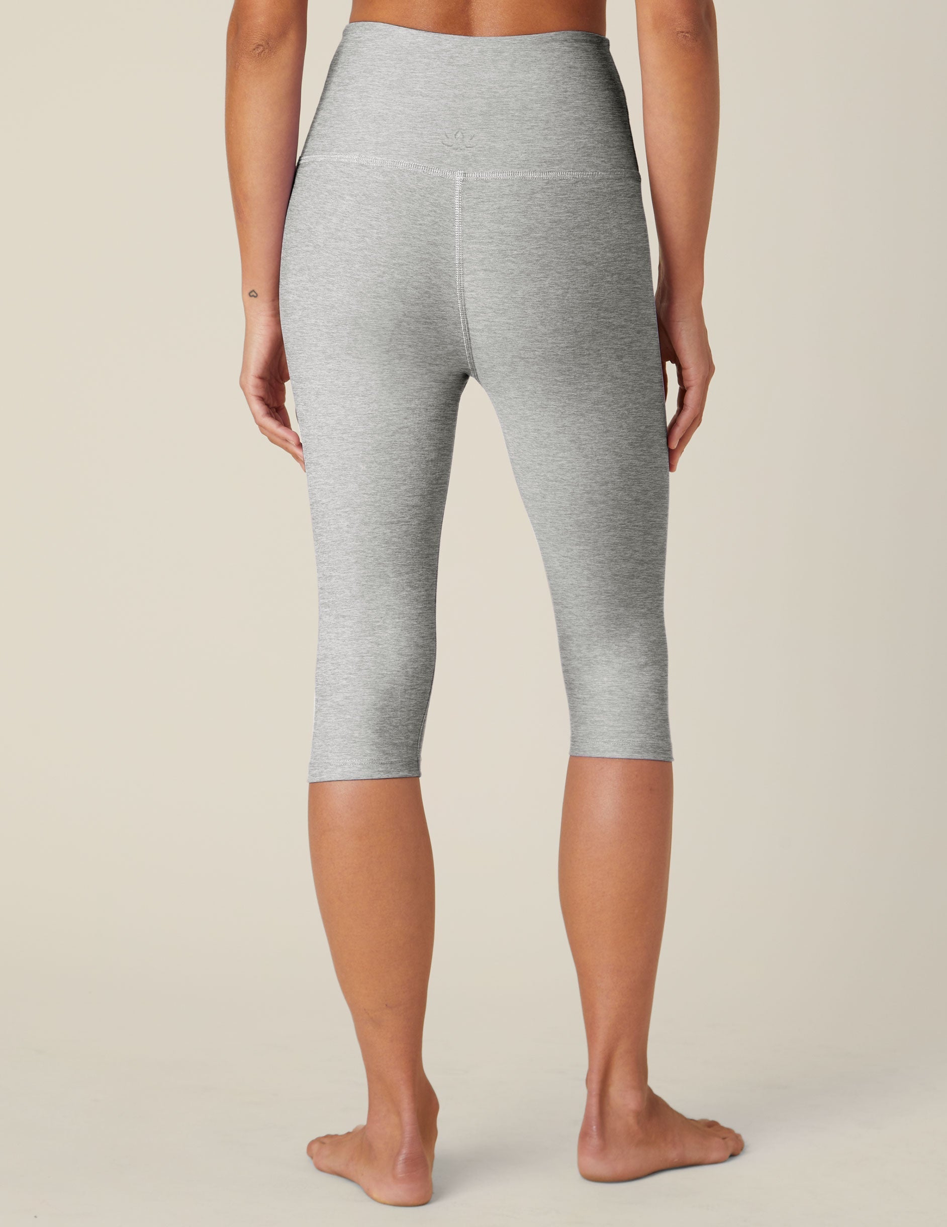 Rear view of Spacedye Pedal Pusher High Waisted Legging in marled gray, cropped below the knee with a snug fit.