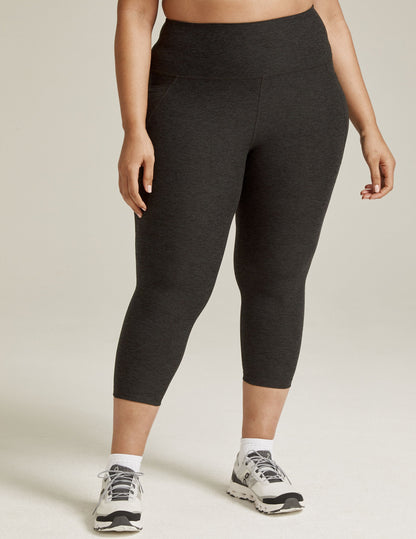 Spacedye Out Of Pocket High Waisted Capri Legging in marled black featuring side pockets and a high-rise, wide waistband.