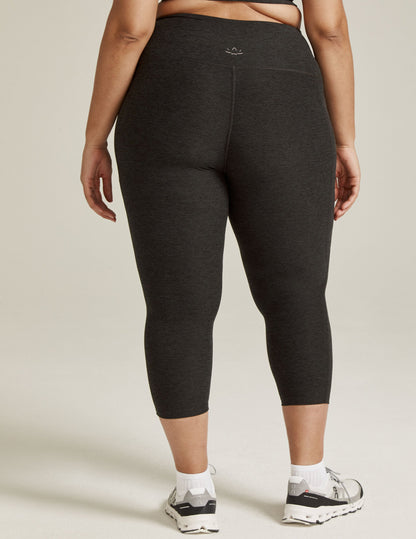 Back view of marled black Spacedye Out Of Pocket High Waisted Capri Legging showing wide waistband and calf-length fit.