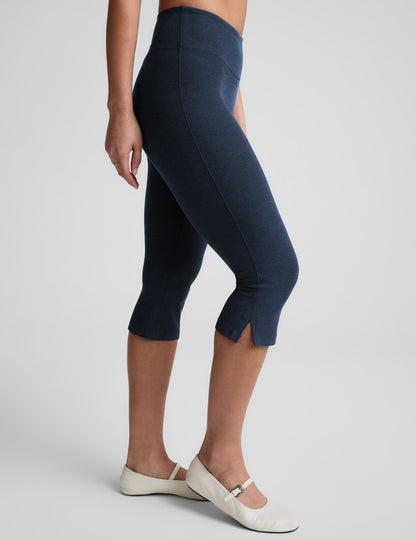 Navy Spacedye Mid-Rise Slit Pedal Pusher Legging on a model showing the snug cropped fit, textured fabric, and side slits.