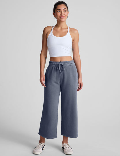 white cropped tank top with a v neckline and high racerback.