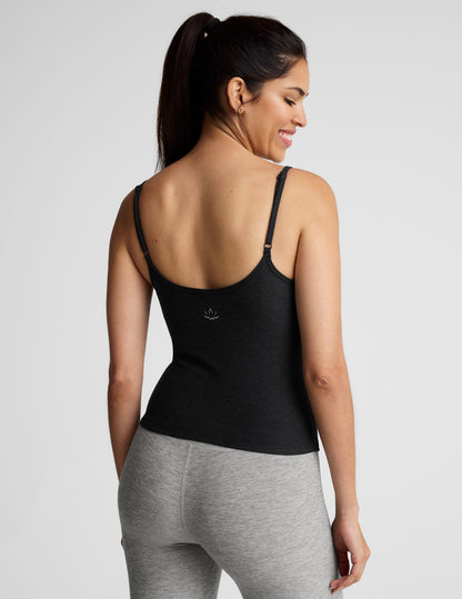 black midway length tank top with adjustable spaghetti straps.