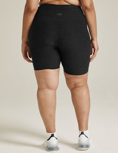 Rear view of Spacedye High Waisted 7" Biker Short in marled black, showing the high waistband and mid-thigh length on a model.