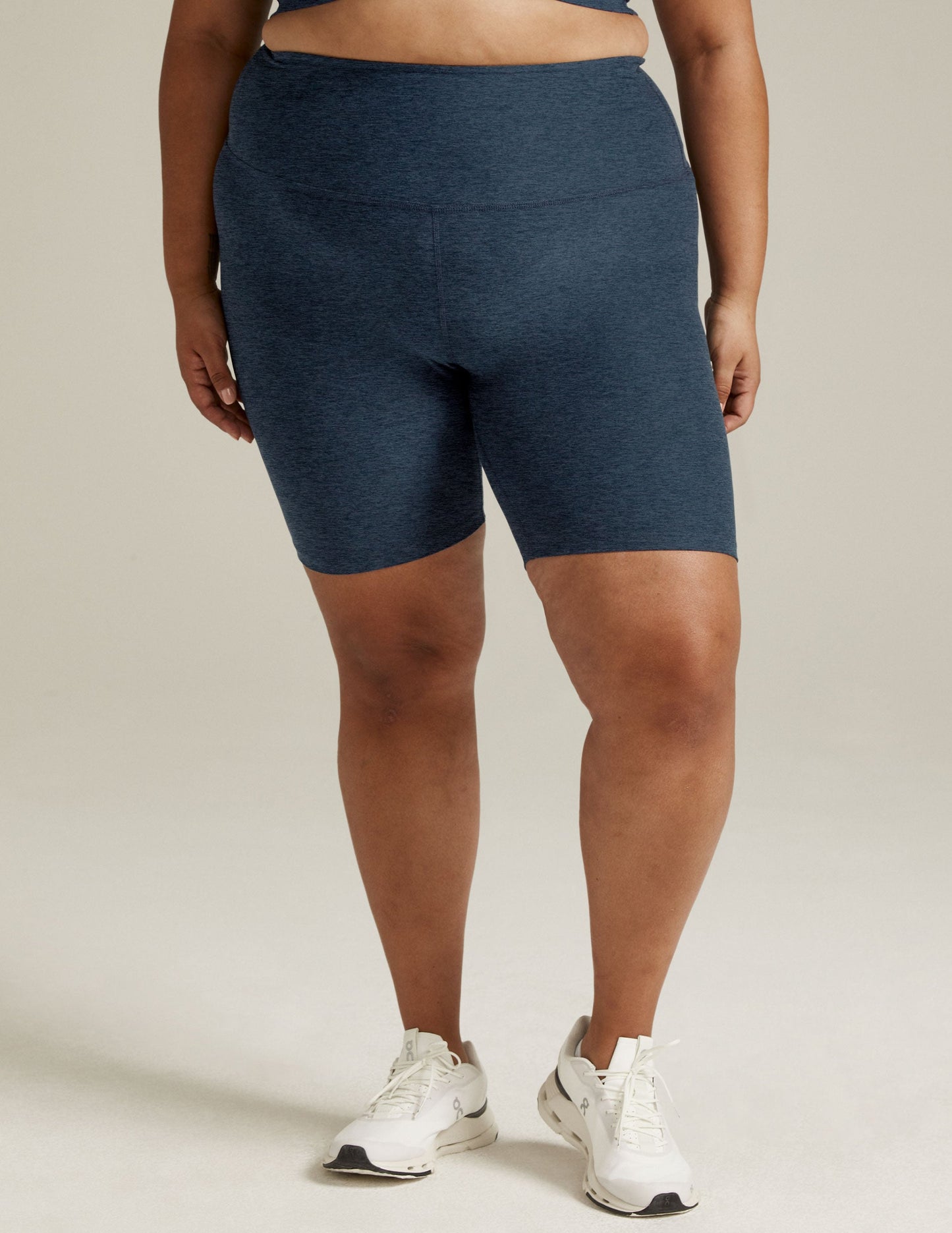 Front view of navy marled Spacedye High Waisted 7" Biker Short on a model, with a snug fit and high waistband.