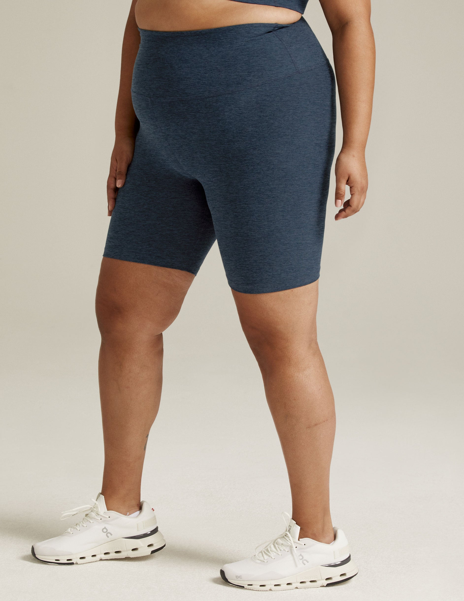 Nocturnal navy marled Spacedye High Waisted 7" Biker Short with a mid-thigh length on a standing model.