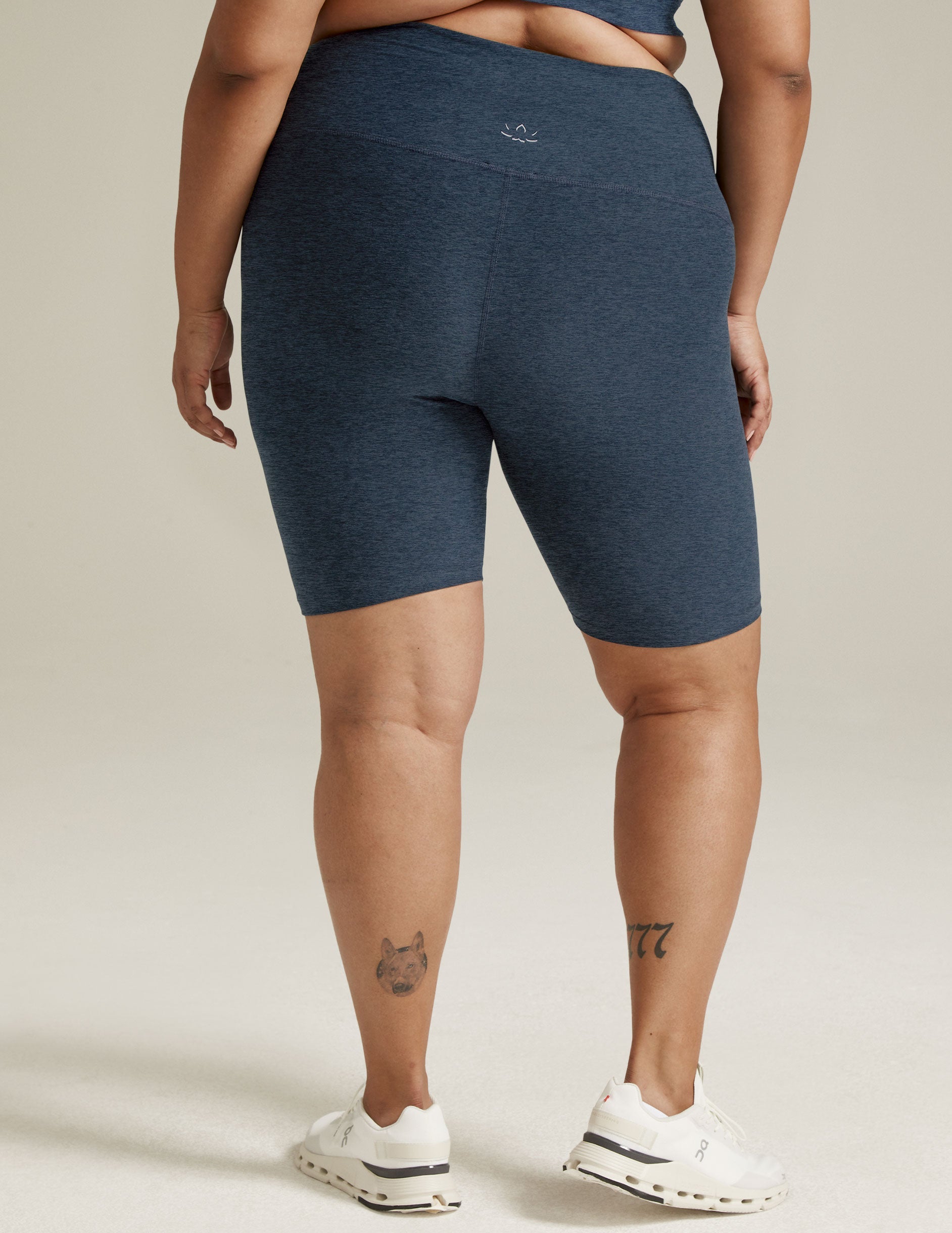 Rear view of the Spacedye High Waisted 7" Biker Short in marled Nocturnal Navy, showing a snug fit and mid-thigh length.
