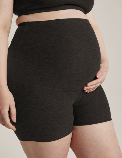 Woman wearing Gray Spacedye™ All For Run Maternity Short in a side profile, paired with a matching marled crop top.
